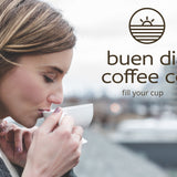 Woman drinking coffee with 'buen dia coffee co.' logo in the background